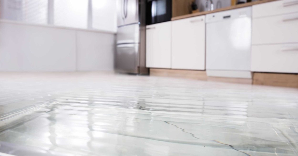Close-up Of Wet Floor Close-up Photo Of Flooded Floor In Kitchen From Water Leak