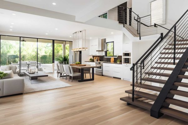 Stylish spacious kitchen and living room with refrigerator and w